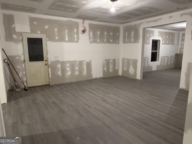 unfurnished room with wood-type flooring