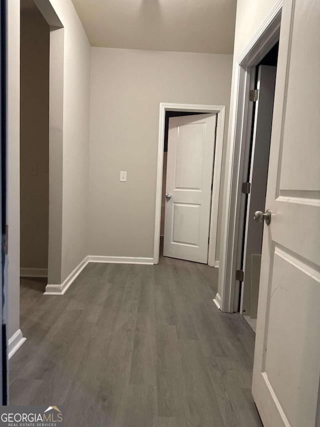 hallway featuring dark wood-type flooring