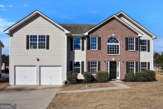 view of front facade featuring a garage and a front lawn