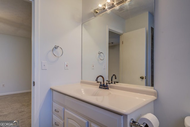 bathroom featuring vanity and a textured ceiling