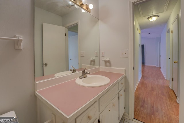 bathroom featuring vanity and hardwood / wood-style flooring