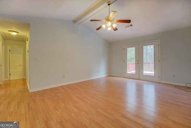 unfurnished room with ceiling fan, french doors, lofted ceiling with beams, and light hardwood / wood-style flooring