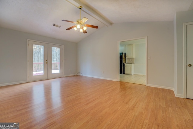 empty room featuring vaulted ceiling with beams, ceiling fan, french doors, and light hardwood / wood-style floors