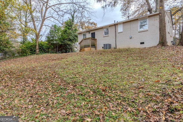 rear view of property featuring central AC unit