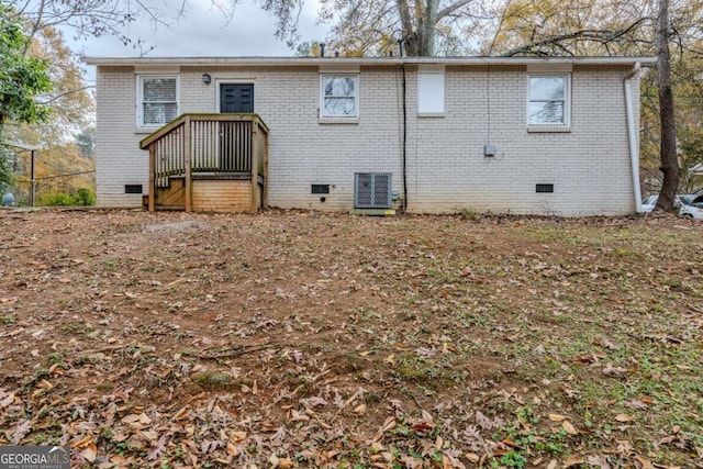 back of property featuring central air condition unit