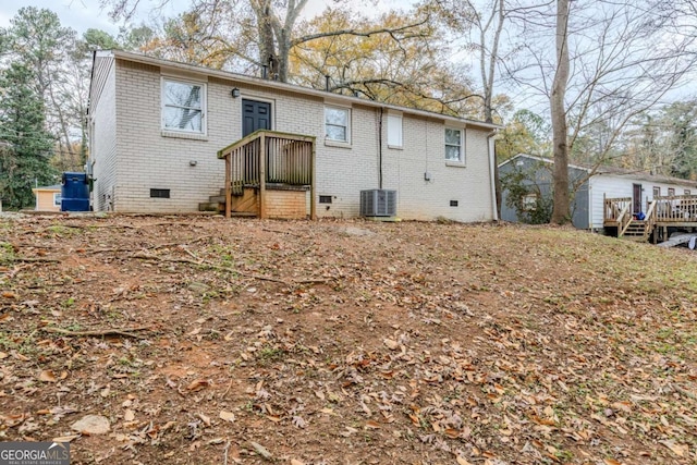 back of property featuring central air condition unit