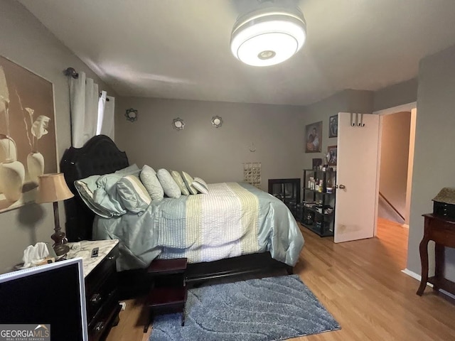 bedroom with light hardwood / wood-style floors