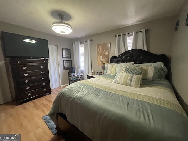 bedroom with light hardwood / wood-style flooring