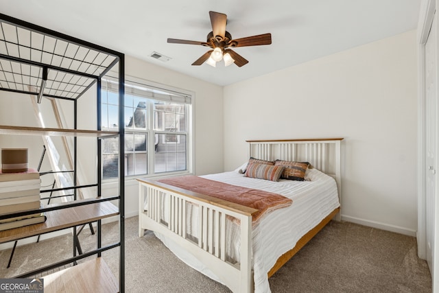 bedroom with ceiling fan, a closet, and carpet