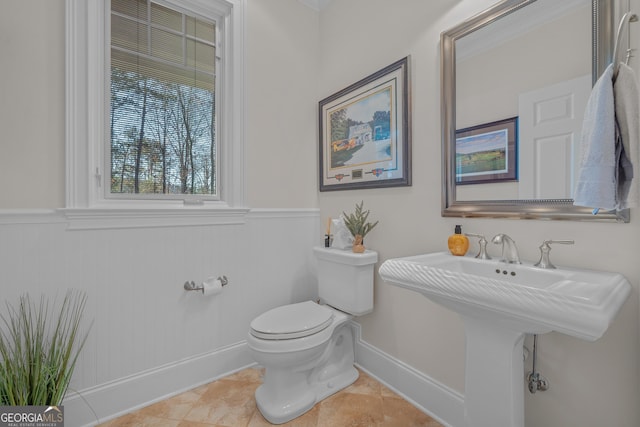 bathroom with tile patterned floors and toilet