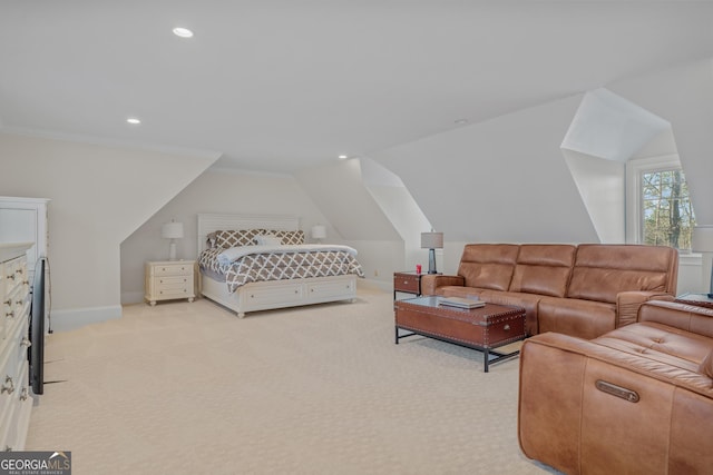 bedroom with light colored carpet, vaulted ceiling, and ornamental molding