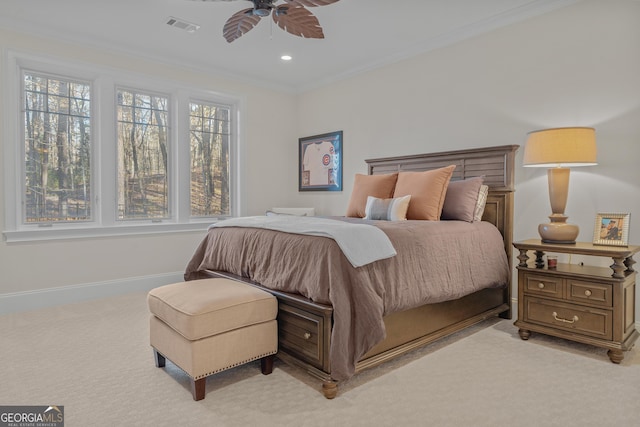 bedroom with multiple windows, ceiling fan, crown molding, and light carpet