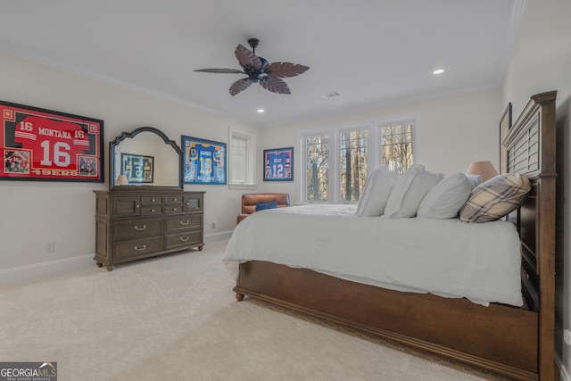 carpeted bedroom featuring ceiling fan and ornamental molding