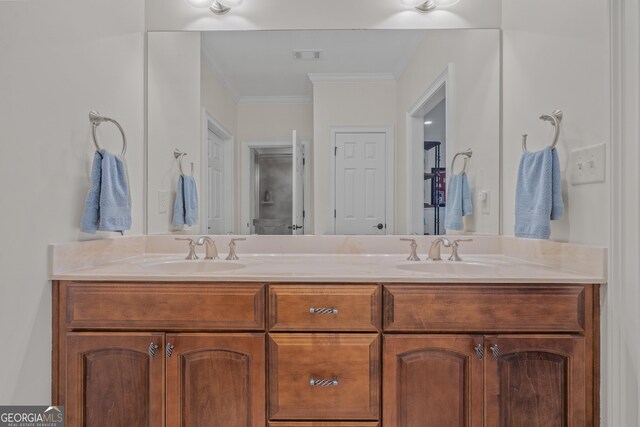 bathroom with vanity and ornamental molding