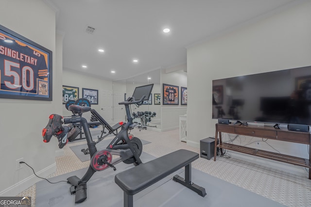 exercise area featuring light colored carpet and ornamental molding