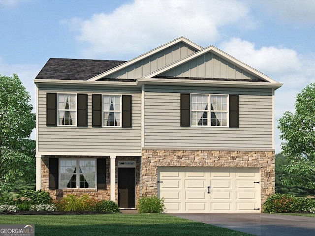 view of front facade featuring a front yard and a garage