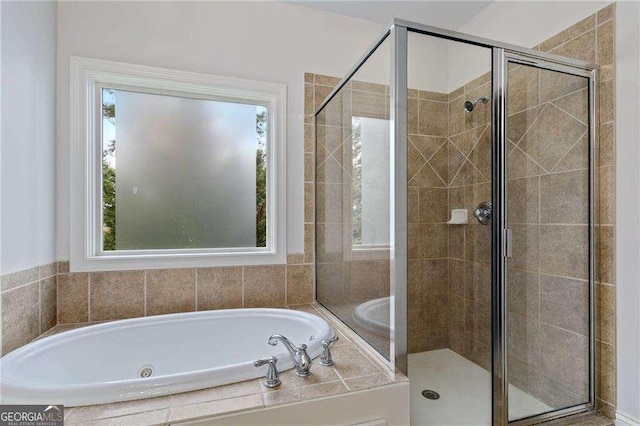 bathroom featuring plus walk in shower