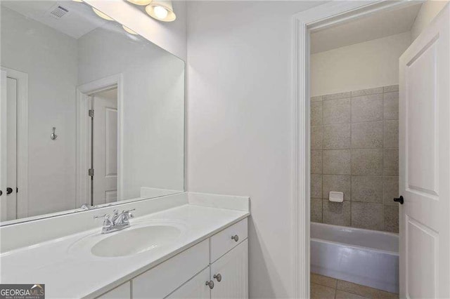 bathroom featuring tile patterned flooring and vanity