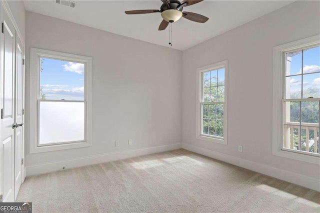 carpeted empty room with ceiling fan