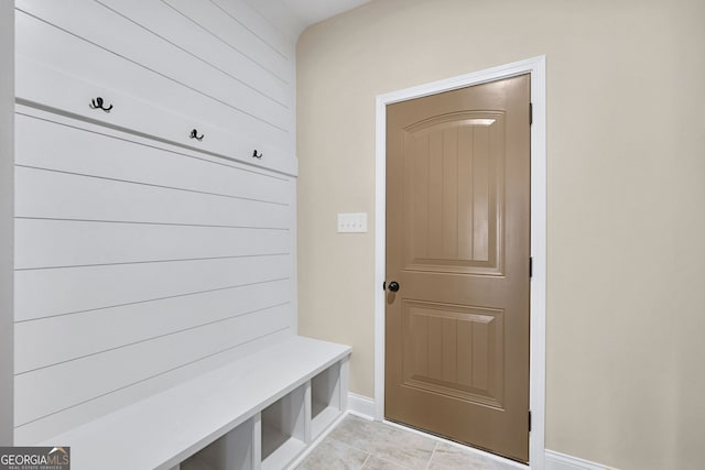 mudroom with light tile patterned flooring