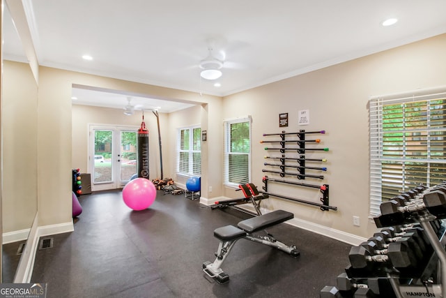 exercise room featuring ceiling fan and ornamental molding