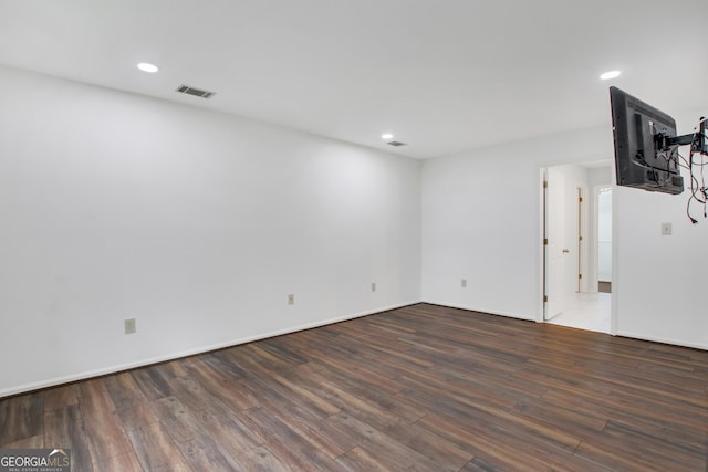 empty room featuring dark hardwood / wood-style flooring