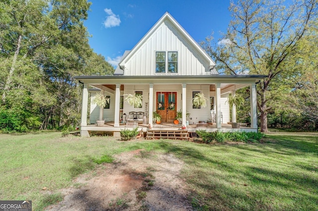 view of front facade featuring covered porch and a front yard