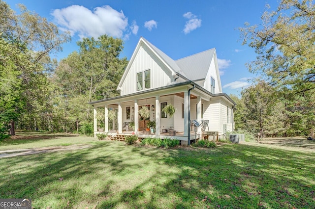 exterior space featuring covered porch and a front lawn