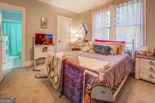 carpeted bedroom with crown molding