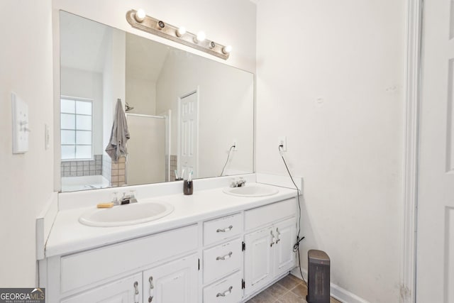 bathroom with tile patterned floors, vanity, and a shower with shower door