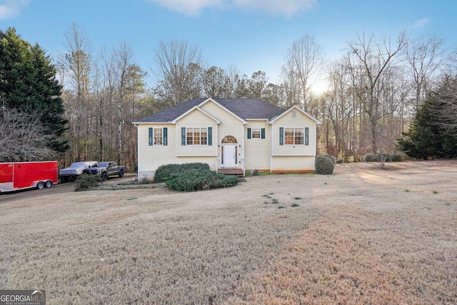 view of front of home with a yard