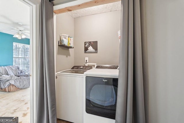 laundry room with ceiling fan, washer and clothes dryer, and carpet