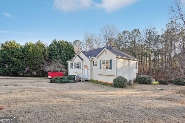 raised ranch with a front yard