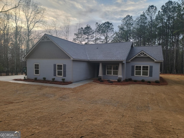 ranch-style home featuring a yard