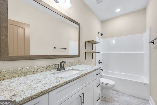 full bathroom featuring shower / bath combination, vanity, and toilet