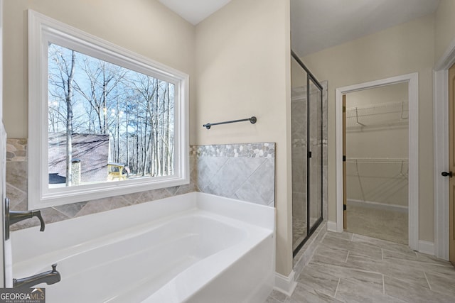 bathroom with shower with separate bathtub