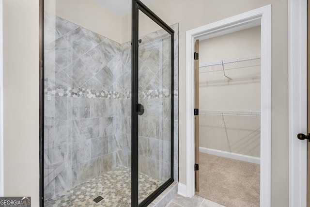 bathroom with a shower with shower door