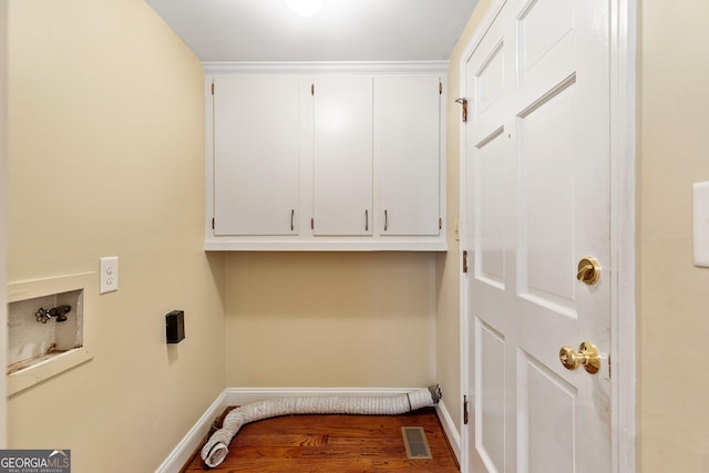 washroom with cabinet space, baseboards, visible vents, hookup for a washing machine, and hookup for an electric dryer