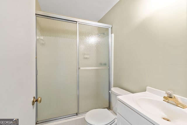 full bath featuring a shower stall, toilet, and vanity