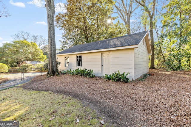 exterior space with an outbuilding and fence