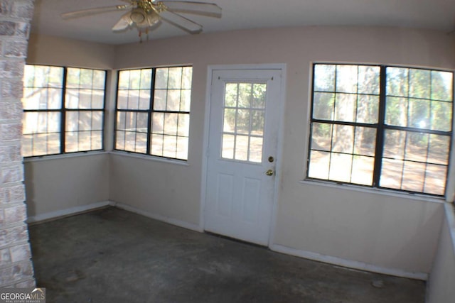 doorway to outside with ceiling fan