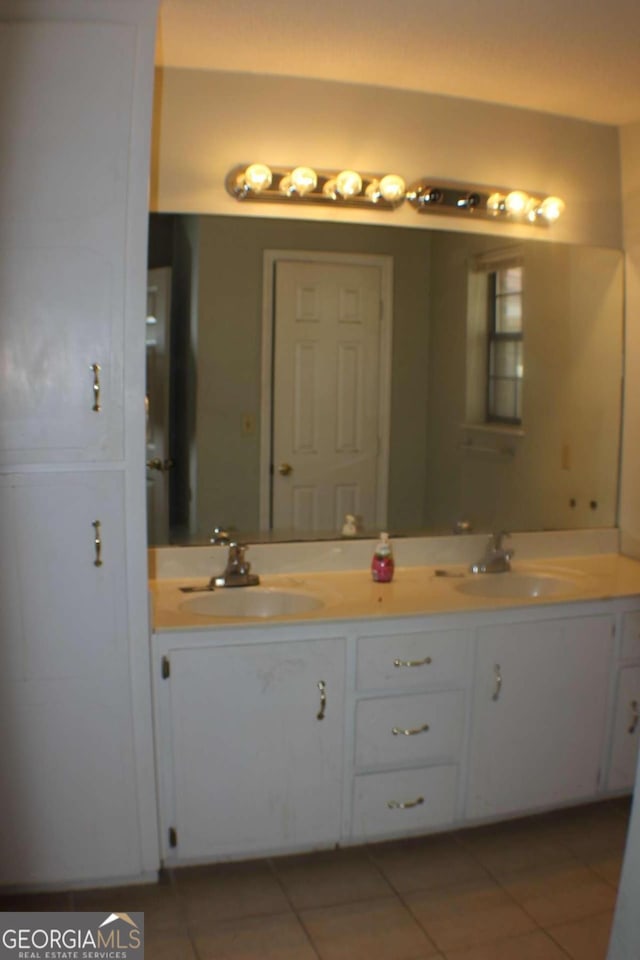 bathroom with vanity and tile patterned floors