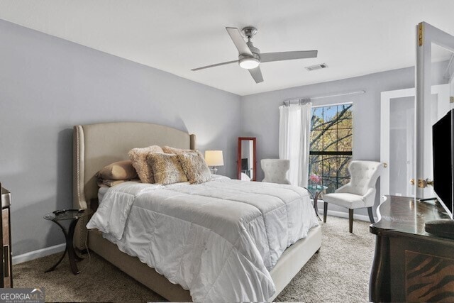 bedroom with ceiling fan and carpet flooring