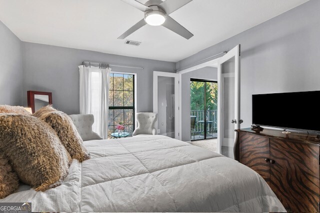 bedroom with access to exterior and ceiling fan