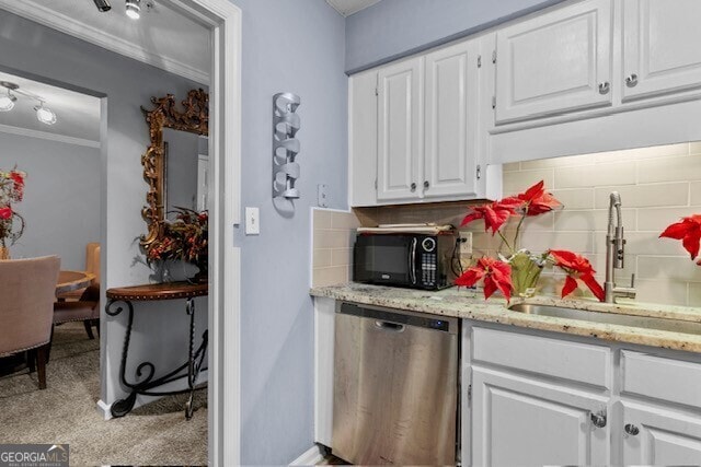 kitchen with sink, crown molding, backsplash, white cabinets, and stainless steel dishwasher