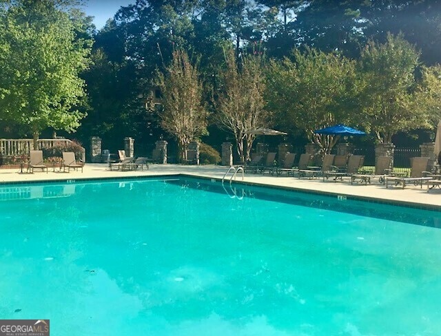 view of swimming pool with a patio