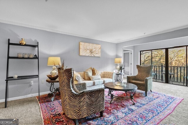 living room with ornamental molding and carpet