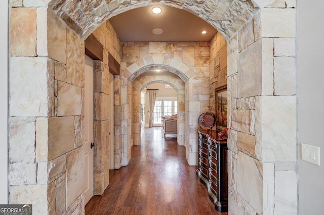 corridor featuring dark wood-type flooring