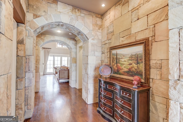 hall with dark hardwood / wood-style floors