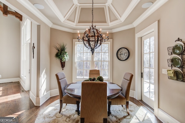 dining room featuring coffered ceiling, dark hardwood / wood-style flooring, crown molding, and an inviting chandelier